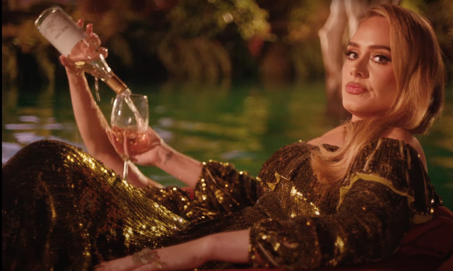 Adele Floats Along a River With a Glass of Rosé in the Dreamy “I Drink Wine” Video