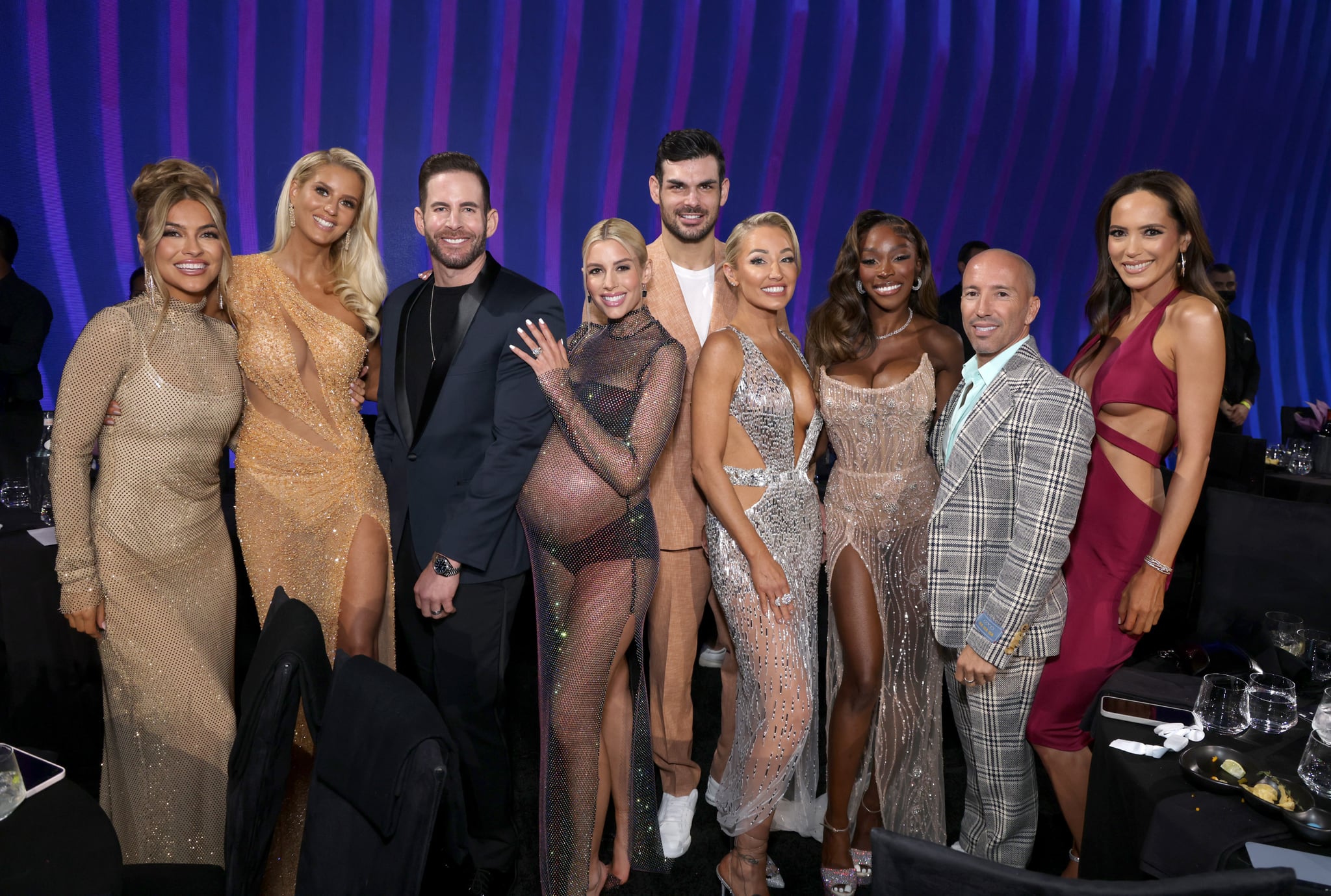 SANTA MONICA, CALIFORNIA - DECEMBER 06: 2022 PEOPLE'S CHOICE AWARDS -- Pictured: (l-r) Chrishell Stause, Emma Hernan, Tarek El Moussa, Heather Rae El Moussa, Romain Bonnet, Mary Fitzgerald, Chelsea Lazkani, Jason Oppenheim and Davina Potratz on stage during the 2022 People's Choice Awards held at the Barker Hangar on December 6, 2022 in Santa Monica, California. -- (Photo by Mark Von Holden/E! Entertainment/NBC via Getty Images)